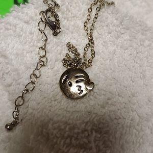 Silver tone winking emoji necklace